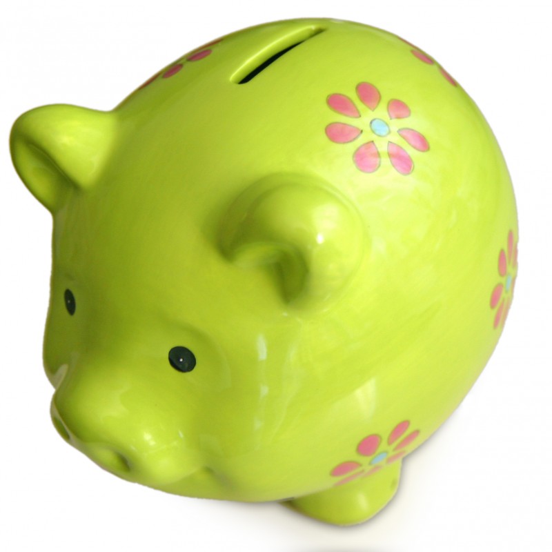 A bright green ceramic piggy bank adorned with pink and red flower designs.