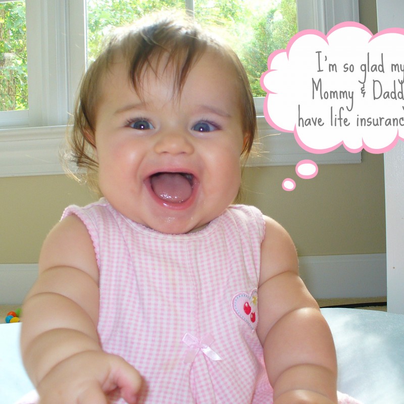 A smiling baby with brown hair and a pink checkered outfit sits in front of a window. The baby has an open mouth, appearing to laugh. A thought bubble above the baby's head says, "I'm so glad my Mommy & Daddy have met their life insurance needs!!!".