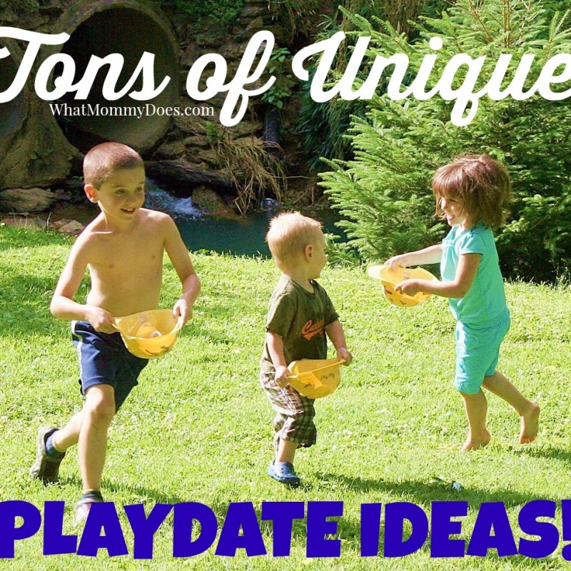 Three young children are playing outside on a grassy lawn. They are carrying yellow buckets and appear to be running or skipping. The text on the image reads "Tons of Fun Playdate Ideas!" with "WhatMommyDoes.com" also mentioned. Trees and greenery are in the background.