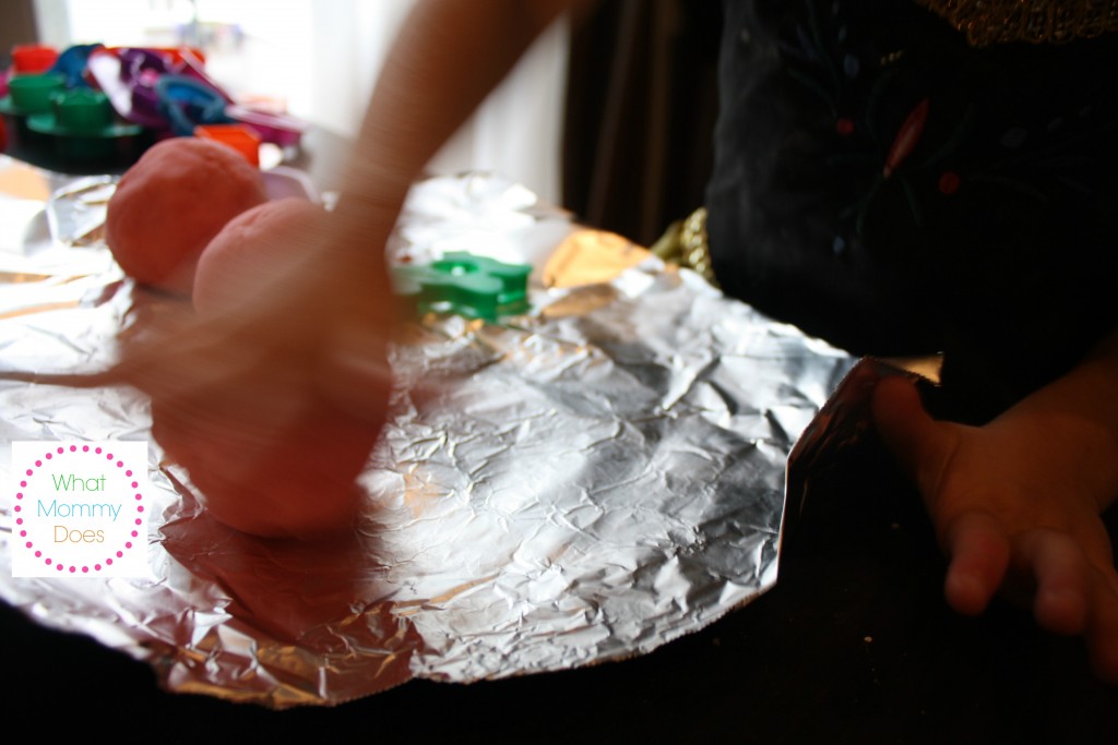 learning how to roll out edible playdough