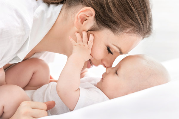 picture of a mom snuggling an infant