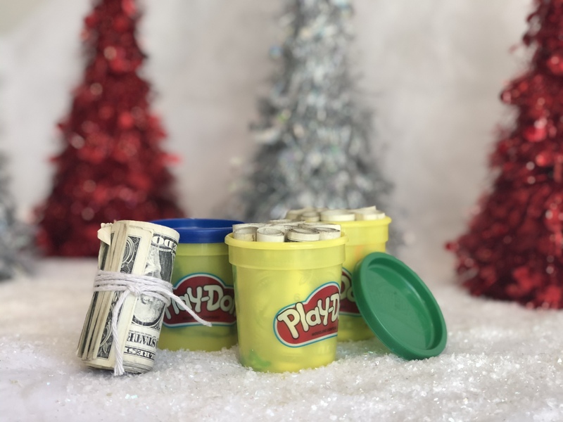 picture of money hidden inside playdough containers - a Christmas gift idea