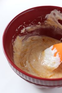 batter in a red bowl