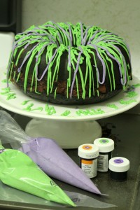 I can't bake very well, and even I was able to make this recipe! Your guests will never guess this amazing marbled Halloween bundt cake is so easy to make. I'm going to use as the feature of my Halloween party food buffet! I think it looks impressive with all the colors! | www.WhatMommyDoes.com | Category: Halloween Dessert Ideas