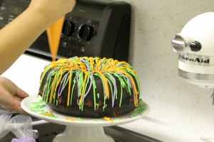 I can't bake very well, and even I was able to make this recipe! Your guests will never guess this amazing marbled Halloween bundt cake is so easy to make. I'm going to use as the feature of my Halloween party food buffet! I think it looks impressive with all the colors! | www.WhatMommyDoes.com | Category: Halloween Dessert Ideas