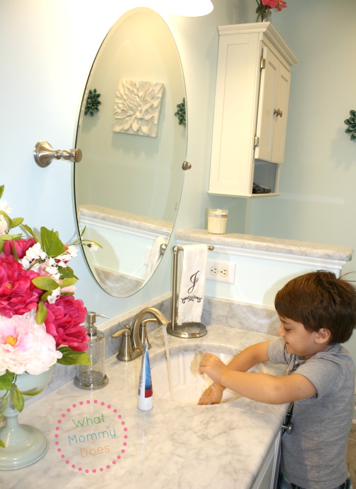 julian playing in sink