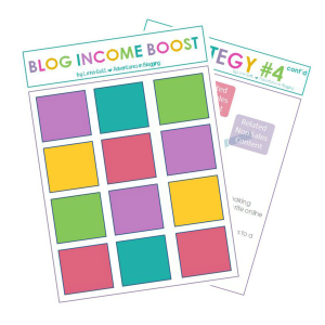 A graphic displaying a sheet titled "BLOG INCOME BOOST" with colorful squares arranged in a grid. Partially visible behind it is another page from the new e-book titled "STRATEGY #4 cont'd," containing text about making money through effective blog strategies.