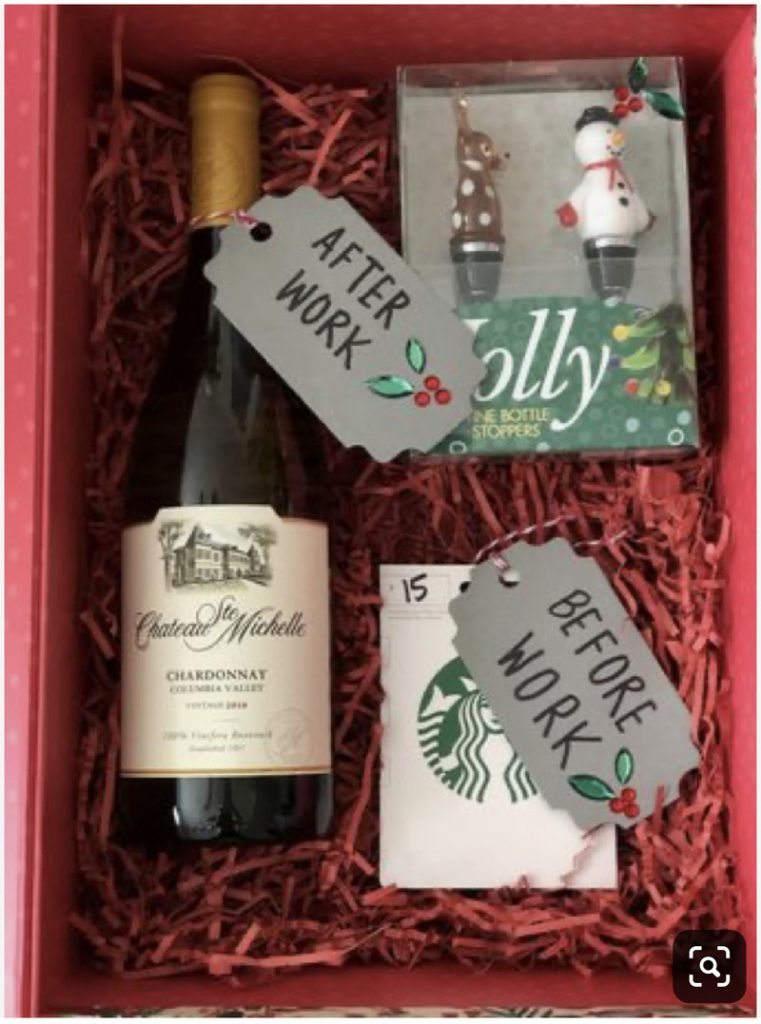 Gift box containing a bottle of Chateau Ste. Michelle Chardonnay wine with a tag reading "AFTER WORK," a Starbucks gift card labeled "BEFORE WORK," and Jolly holiday-themed bottle stoppers, all beautifully arranged on red crinkle paper. Perfect for those who appreciate the hottest crafts of the season!