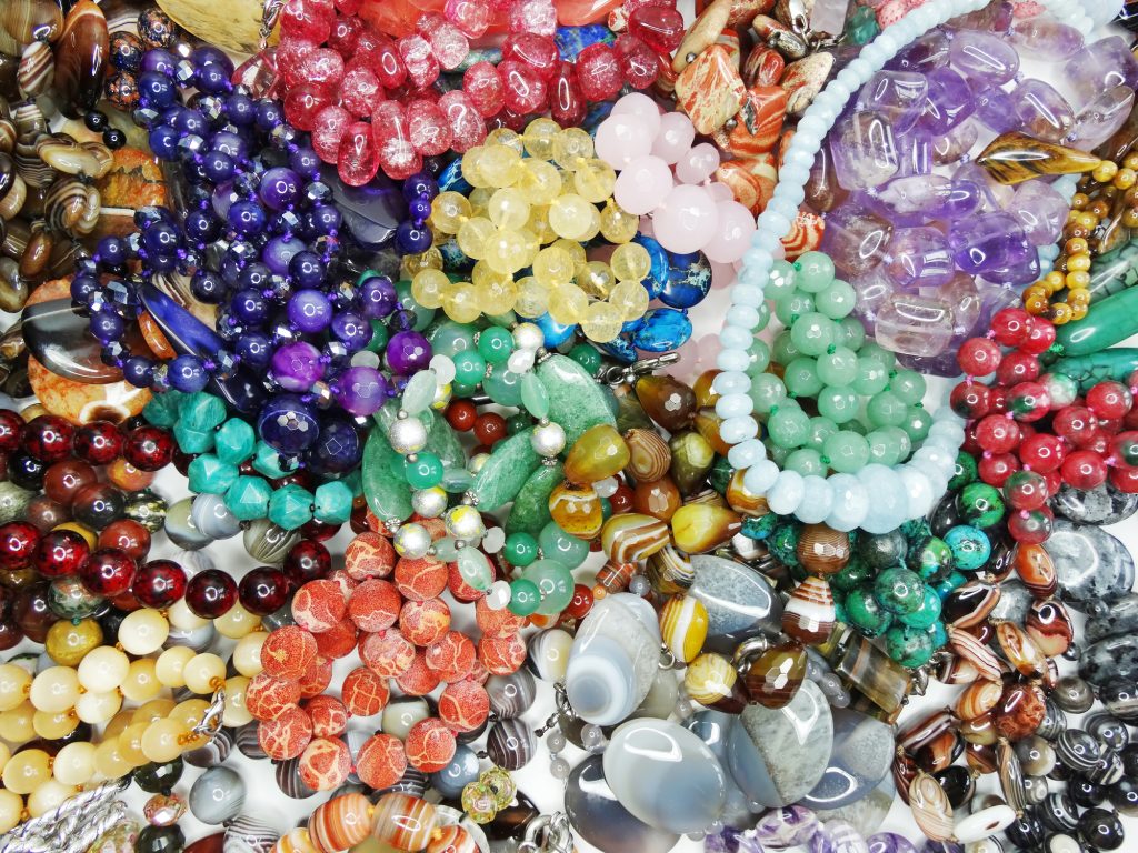 Piles of beads to create jewelry for young entrepreneurs