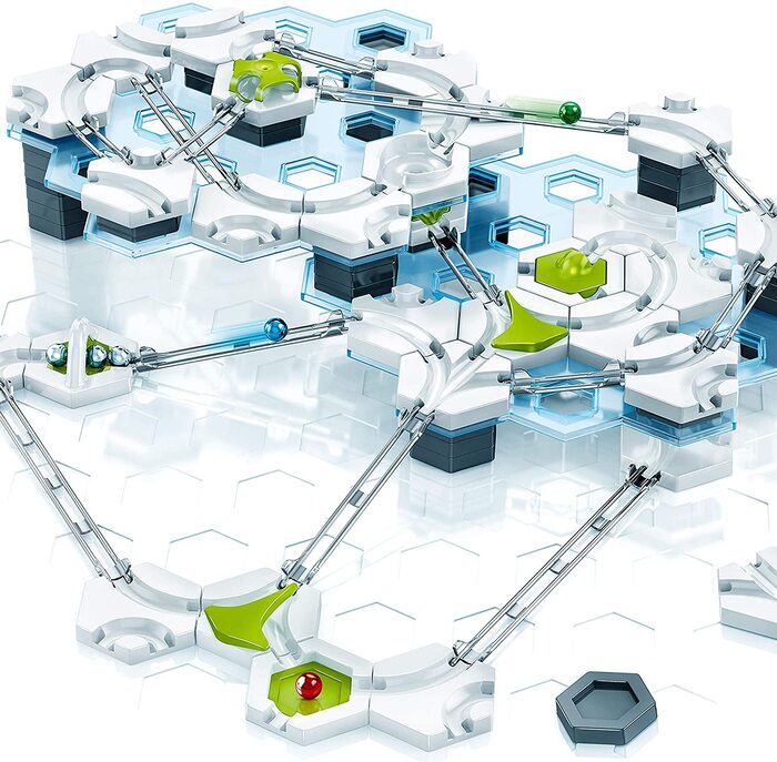 A detailed image of a marble run set comprised of interlocking tracks, platforms, and various components. Featuring ramps, green and red switches, and blue-and-white elements, it creates a complex network of paths for the marbles to travel through—one of the perfect gifts for smart kids.