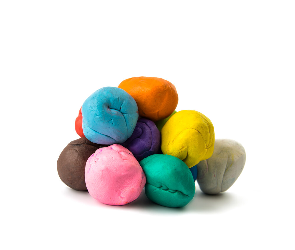 a modelling clay ball of different colors isolated on a white background