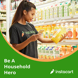 A woman wearing an Instacart t-shirt uses her phone while holding a bottle of juice in a grocery store. Shelves filled with various juice options are in the background. The text "Be A Household Hero" and "make $500 extra per month" alongside the Instacart logo are displayed at the bottom of the image.