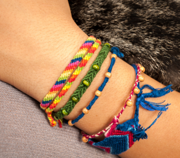 Closeup of a colorful friendship bracelet on a child's hand 