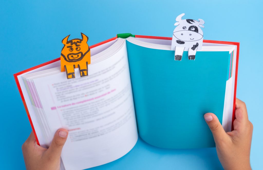 handmade bookmarks of cows on a book