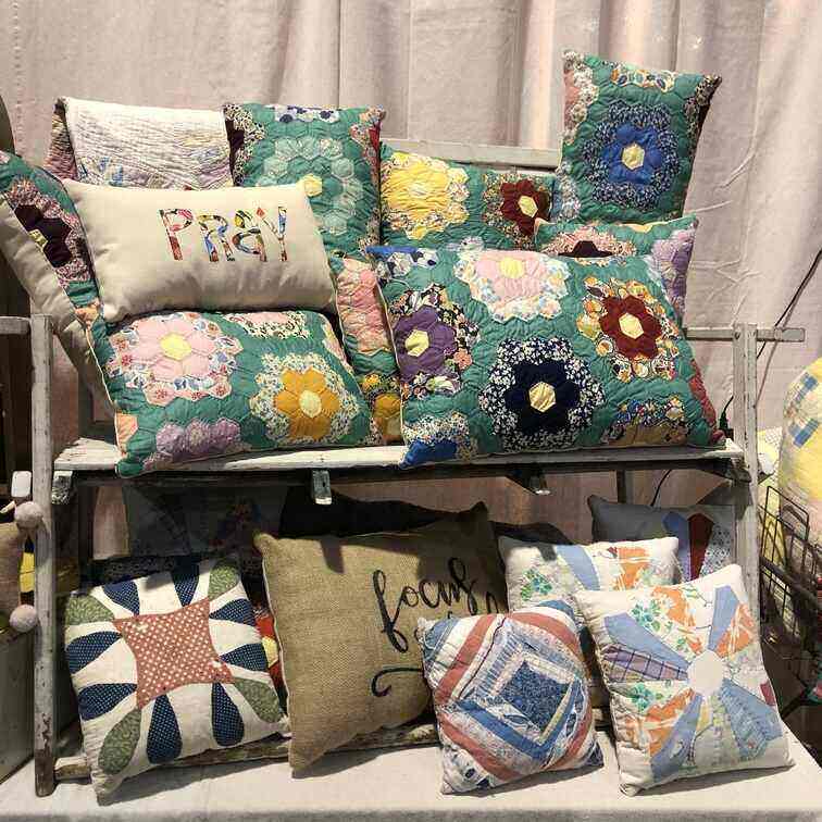 Old quilts that have been turned into throw pillows