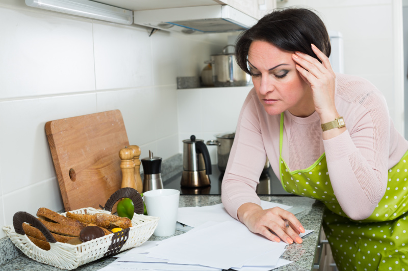 Mom doing meal planning in the kitchen