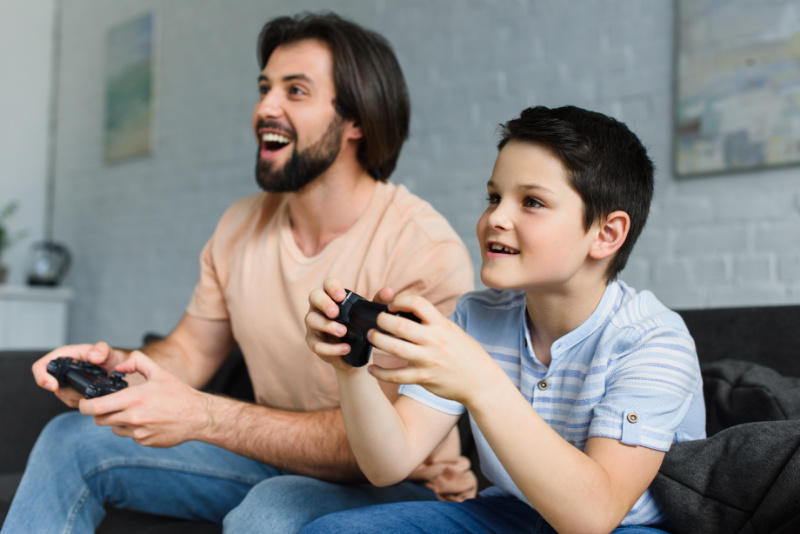 dad and son play video games