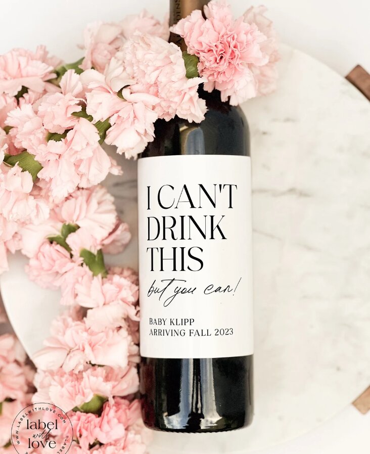 wine bottle with a specialized label announcing pregnancy