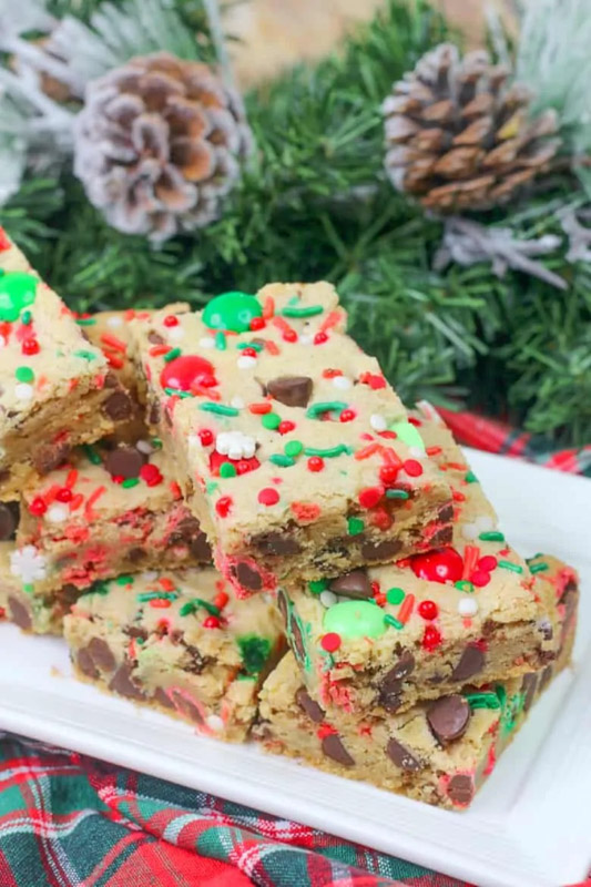 cookie bars with red and green m&m's and sprinkled scattered throughout