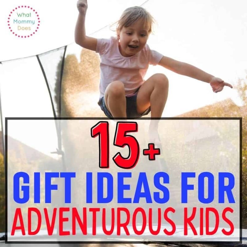 A young child is mid-jump on a trampoline with a blurred background of trees and a clear sky. The overlaid text reads "15+ Gift Ideas for Outdoorsy Kids." A small logo on the top left corner says "What Mommy Does.