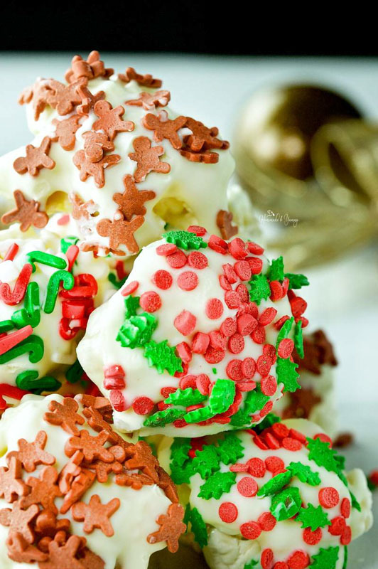 popcorn coated in melted chocolate with red, green and gingerbread sprinkles