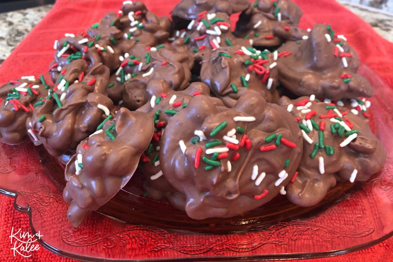 candy and nuts coated in chocolate and sprinkled with holiday Jimmies