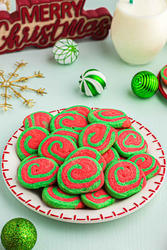 a plate of spiraled red and green sugar cookies