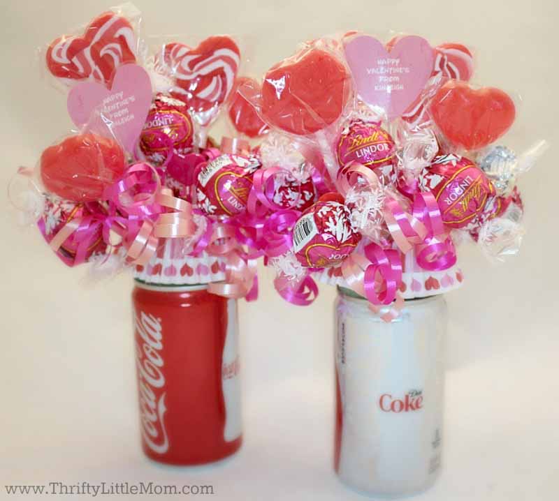 bouquets of pink and red lollipops in coke cans
