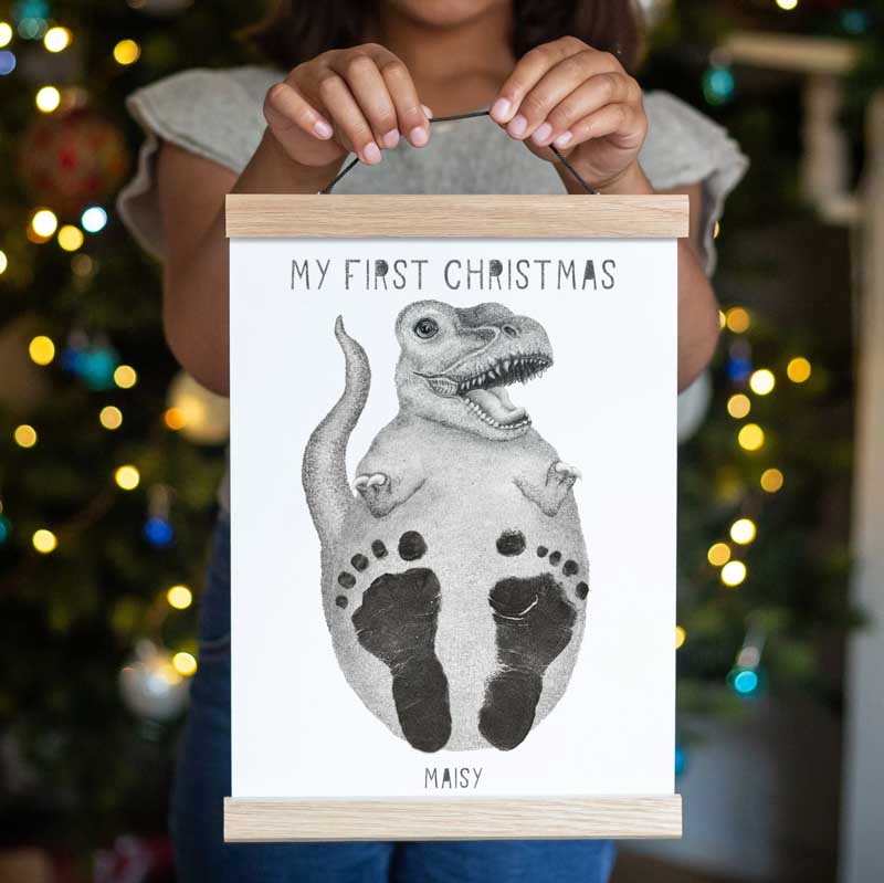 dinosaur print with newborn feet inked on