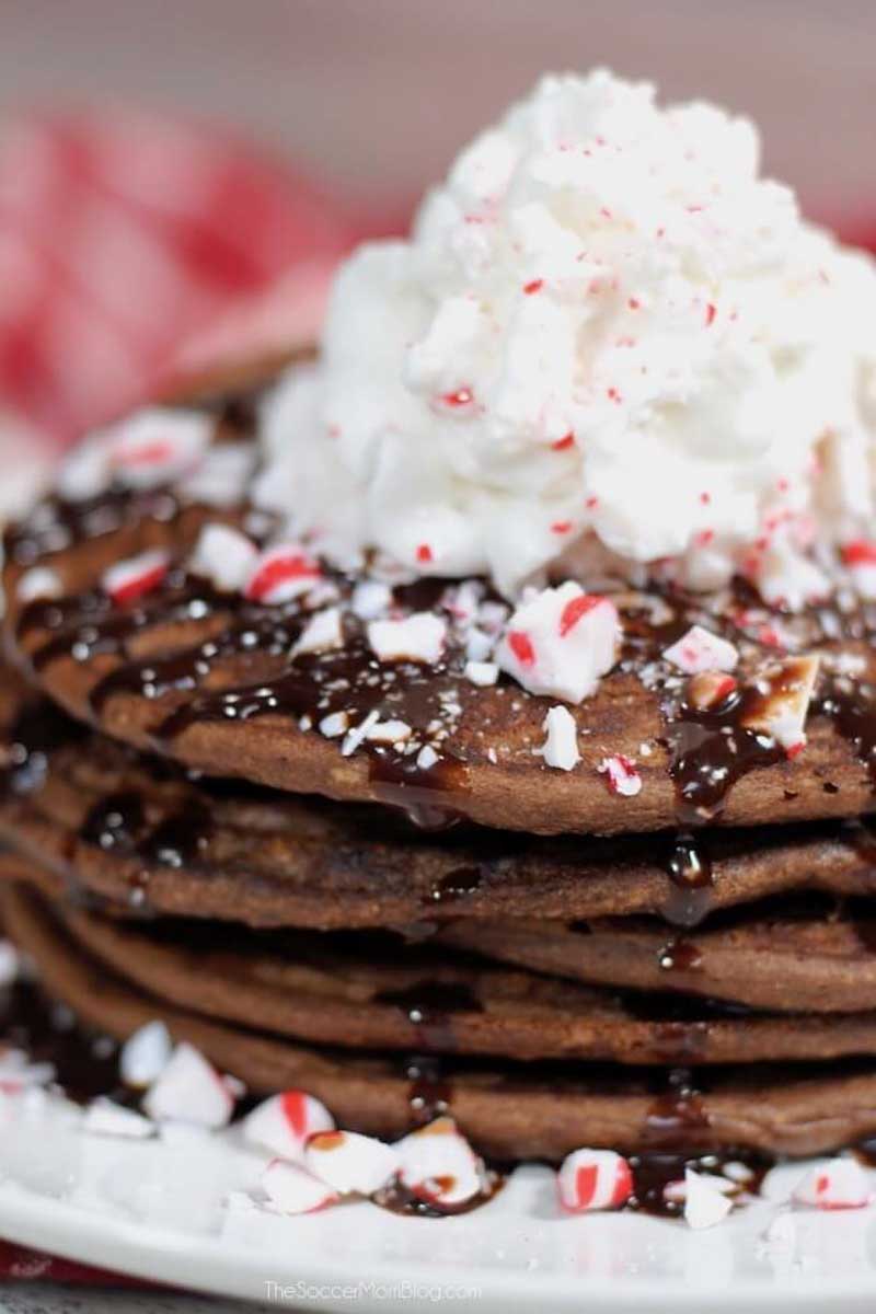 hot cocoa pancakes with peppermint candy sprinkles on top
