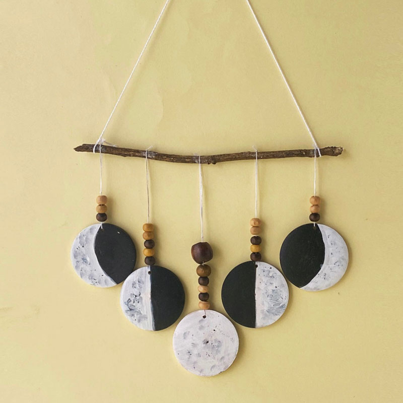 wall hanging with phases of the moon