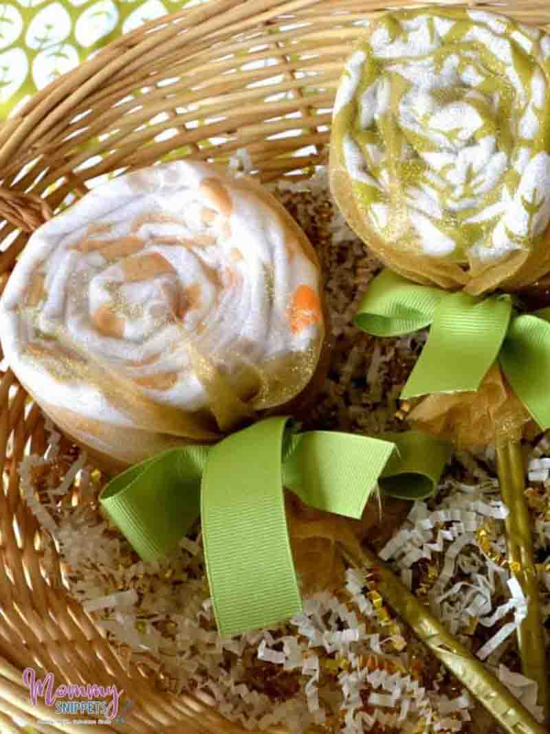 basket with rolled up baby blankets inside