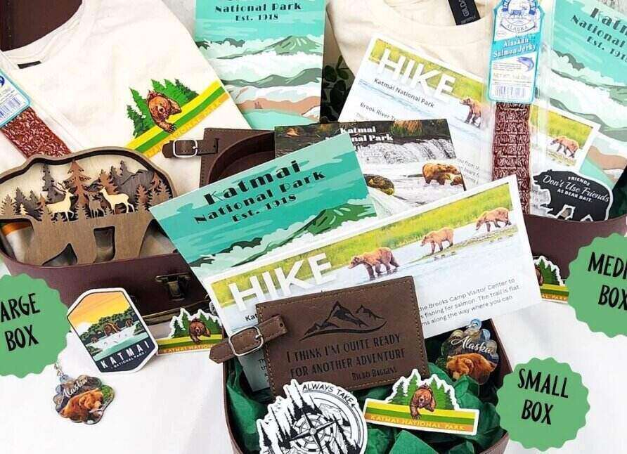 A bunch of items from national parks sitting on a white table top
