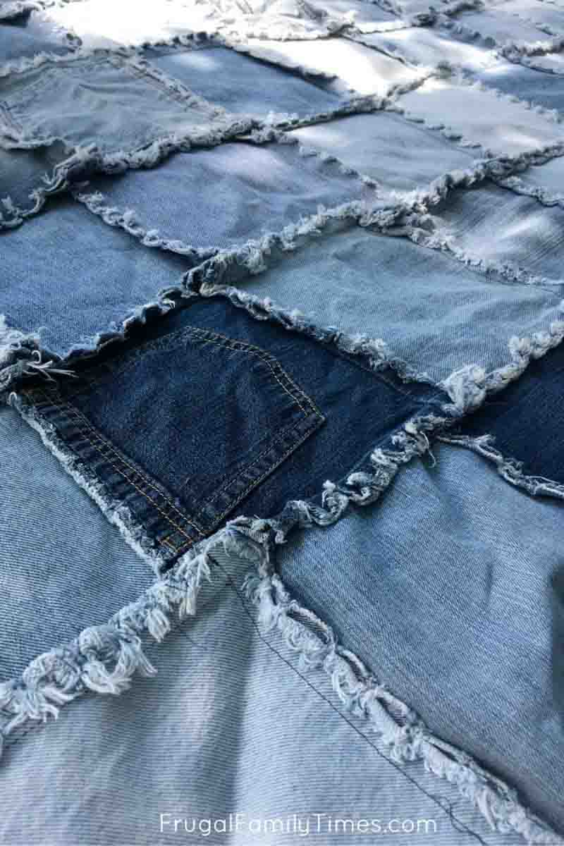 close up of a DIY denim patchwork quilt
