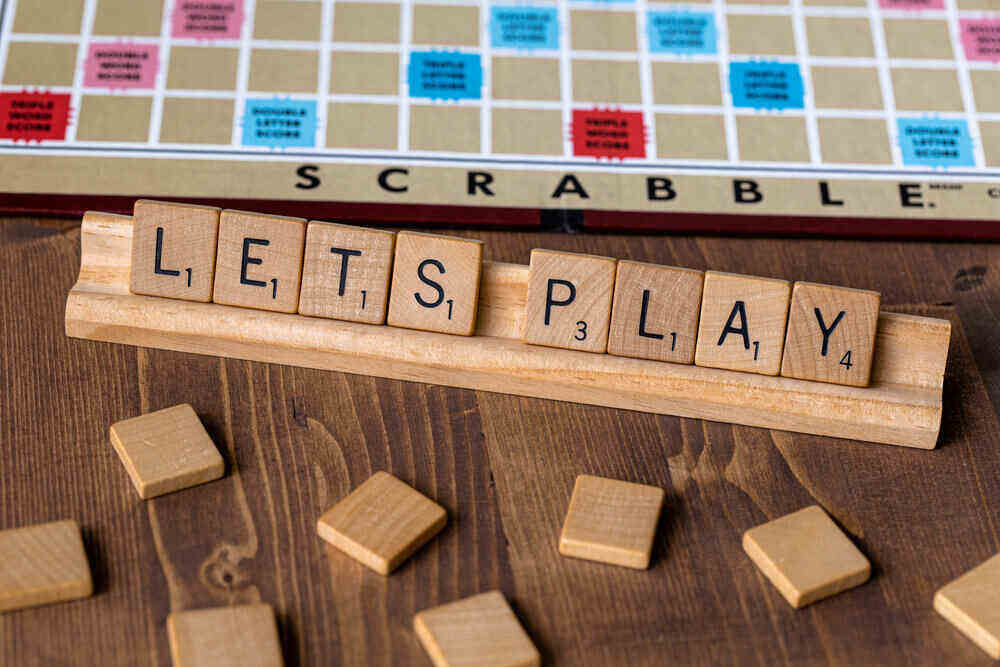Scrabble Board with words Lets Play laid out