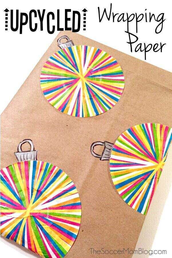 A brown paper wrapped package with glued on cupcake wrappers designed to look like Christmas bulbs.