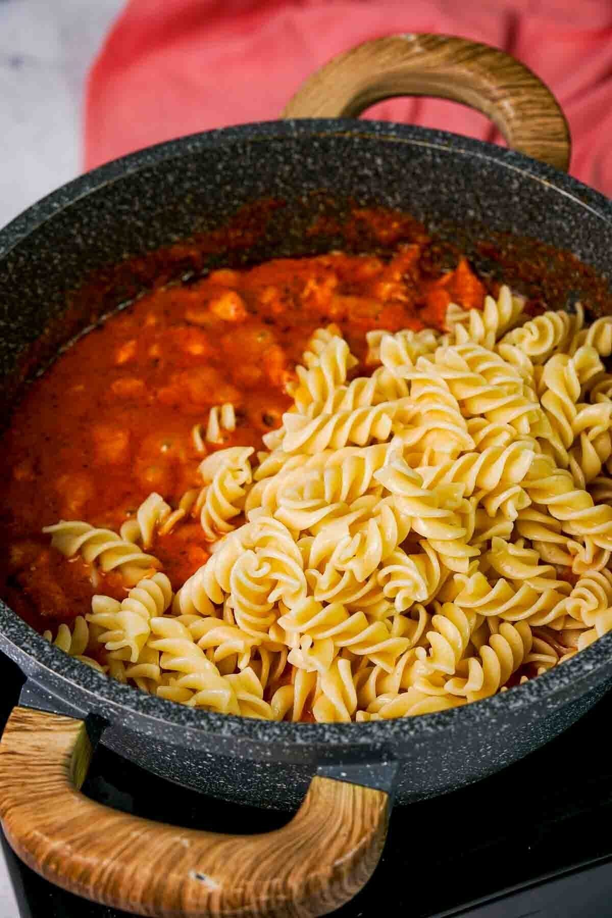 picture of butter chicken pasta in process of cooking