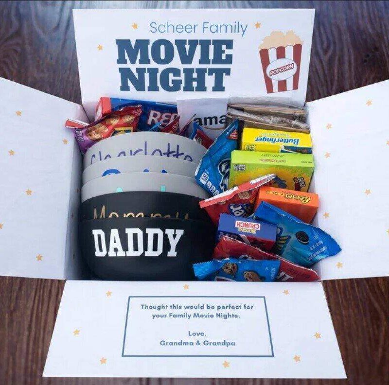 gift pack with various movie snacks in a box with the words Movie Night on it