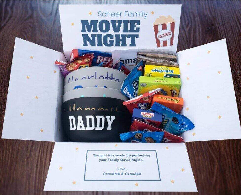 gift pack with various movie snacks in a box with the words Movie Night on it