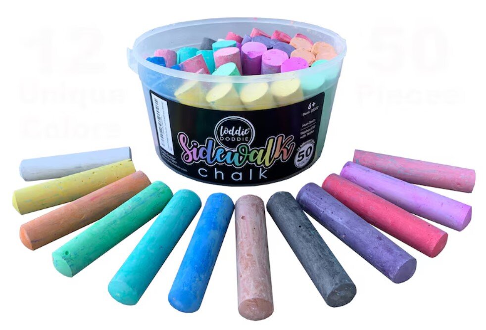 various colors of sidewalk chalk displayed in front of the plastic container they came from