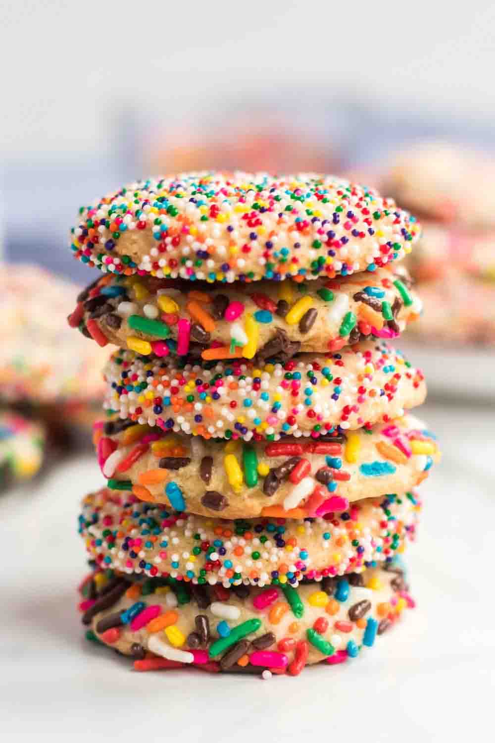 Festive sugar cookies rolled in rainbow sprinkles, easy DIY baby shower desserts to brighten a dessert table.